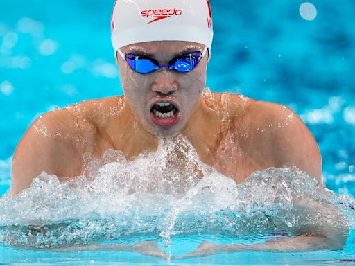 Another Chinese Olympic swimming medalist linked to doping scandal denies any wrongdoing
