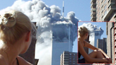 Fact Check: This Photo Truly Shows a Woman Watching as 1 of the Twin Towers Burned on 9/11