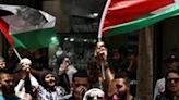 Palestinians in the occupied West Bank city of Ramallah took to the streets in protest at the Israeli strike on Rafah
