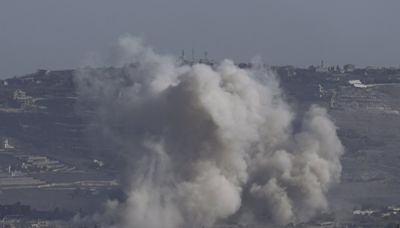 Middle East latest: An Israeli airstrike cuts a major highway linking Lebanon with Syria