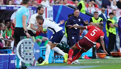Harry Kane is sent FLYING into Gareth Southgate