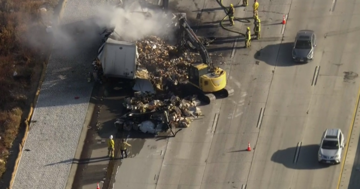 Semi-truck's trailer catches fire on 15 Freeway, clogging up traffic in San Bernardino