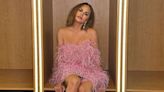 Chrissy Teigen Dons Dramatic Strapless Pink Feather Dress for Miss Universe 2023