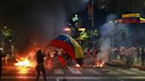 Protesters clash with police in Venezuela after Nicolas Maduro wins re-election