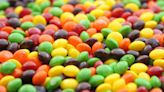 A lawsuit claims Skittles is 'unfit for human consumption' because it contains a chemical that's banned in Europe for potential cancer risk