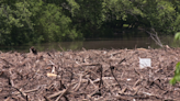 Debris-cluttered Neosho River causes concern at Twin Bridges Area