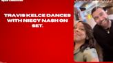 Travis Kelce dances with Niecy Nash on set.