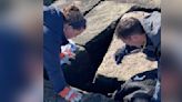 Rescuers Look Between Cracks In Rock And See A Little Face Staring Up At Them