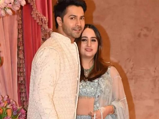 ...Radhika Merchant's sangeet : Varun Dhawan and Natasha Dalal make their...welcoming their daughter last month | Hindi Movie News - Times of India