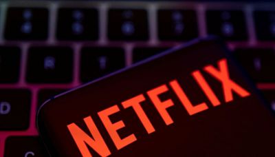 Netflix slips after stopping subscriber tally report, downbeat Q2 revenue forecast