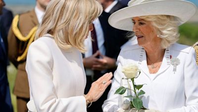 Brigitte Macron red-faced as she tries to hold Camilla's hand at D-Day memorial
