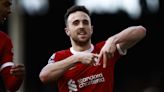 Liverpool win at Fulham to go level with league leaders Arsenal