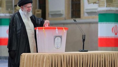 Iran's Supreme Leader Ayatollah Ali Khamenei votes during the presidential election in Tehran