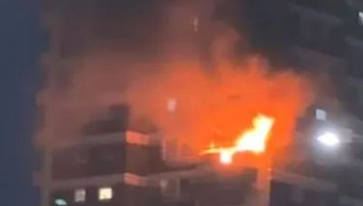 Flames leaping from tower block as inferno rips through 10th-floor flat