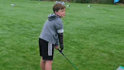 Boy with limb difference ‘excited’ to play golf with grandfather thanks to tool