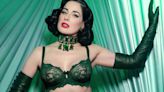 Burlesque star Dita Von Teese, 51, shows off her curves in green lingerie