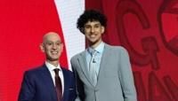 NBA commissioner Adam Silver, left, poses with France's Zaccharie Risacher, right, after Risacher was selected by the Atlanta Hawks with the first overall pick in the first round of the NBA Draft