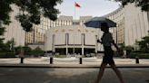 China investors snap up government bonds, prompting central bank warning