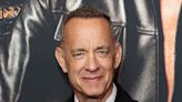 Tom Hanks says it’s an ‘honour’ to crash weddings, after being repeatedly photographed with newly married couples