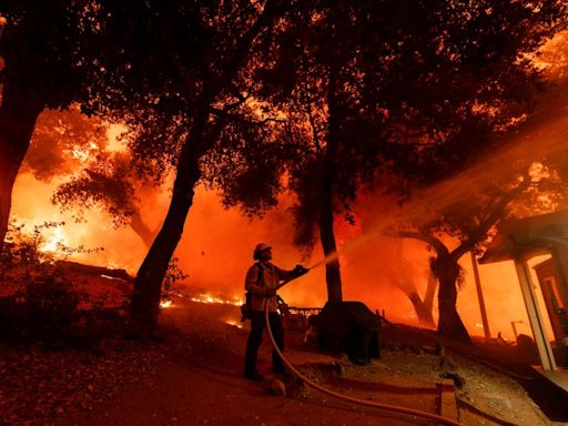 Airport Fire in Riverside, Orange counties slows overnight but still threatens homes