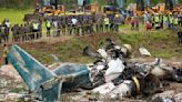 18 dead after plane slips off runway and crashes at Nepal airport