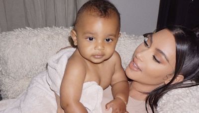 Psalm West, 4, looks grown up as he and mom Kim attend Saint's basketball game