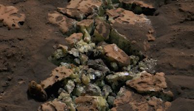 NASA Scientists Startled When Mars Rover Drives Over Rock, Cracking It and Revealing Glinting Crystals Within