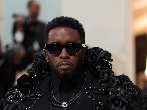 Diddy ate chocolate strawberries off naked woman at high-profile Miami party attended by Will Smith, Bruce Willis