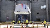 'Go for Stack': 1st parts of space shuttle Endeavour vertical display lifted into place at California Science Center