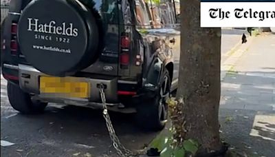 Driver chains £100,000 Land Rover to a tree in an attempt to beat thieves