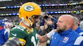 Green Bay Packers quarterback Aaron Rodgers throws with his thumb wrapped during Thursday's practice