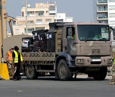 Gunfire, lawlessness and gang-like looters are preventing aid distribution in Gaza, an official says