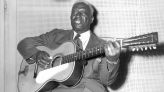 His underrated guitar playing influenced everyone from the Beatles to Nirvana – here's how Lead Belly used his 12-string skills to play his way out of prison