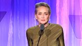 Sharon Stone says she 'lost half of my money to this banking thing' during a teary-eyed speech at a charity fundraiser