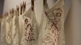 New redwork installation stitches provoking stories of war and injustice