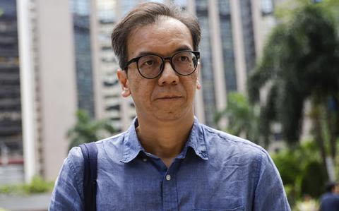 Hong Kong court sentences editor to 21 months in jail in a case seen as a barometer of press freedom