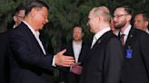 Putin and Xi's bromance continues as Chinese leader HUGS Vladimir