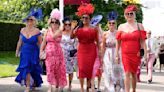 Glamorous racegoers don colourful gowns for Ladies Day at Goodwood