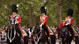 King Charles III rides on horseback in first official birthday parade