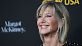 Olivia Newton-John’s husband and daughter say she’s visited them as a ‘blue orb’ since dying