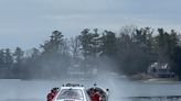 Trapped swan rescued from frozen Orion Township lake