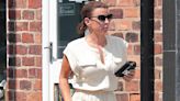 Coleen Rooney puts on a very leggy display in a cream playsuit