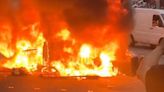 Man charged after bus set on fire during Leeds riots as five more arrested