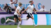 Germany ease to win over Spain to qualify as group winners