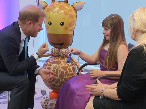 Prince Harry receives gifts from inspirational girl, 10, at WellChild Awards in London