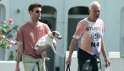Michael Barrymore, 72, steps out with male companion and dog
