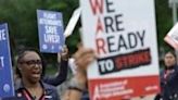 American Airlines flight attendants and their supporters form a picket line outside the White House