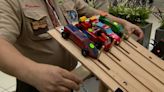 Cub Scouts race Pinewood Derby cars at Woodfield Mall