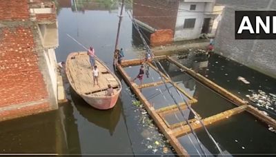 UP news: People use boats to commute in Moradabad amid severe waterlogging after heavy rains | Watch video | Today News