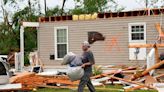 Storm-battered South is again under threat. A boy swept into a drain fights for his life